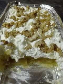 Una foto de Manzana con nata y nueces