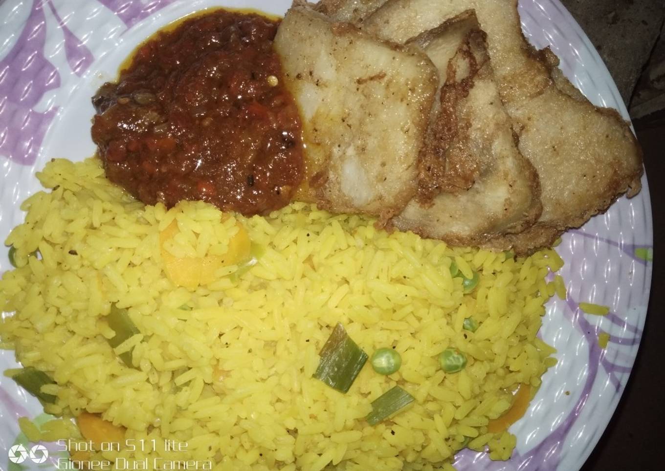 Colored rice and fried yam with egg
