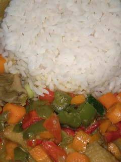 A picture of Rice and chicken curry sauce with coconut milk.
