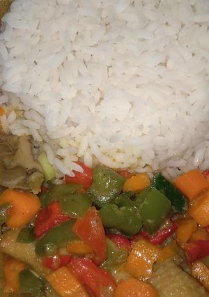 A picture of Rice and chicken curry sauce with coconut milk.