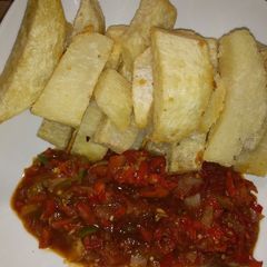 A picture of Yam strips with sauce.