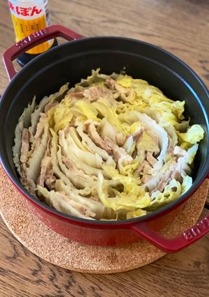 A picture of Japanese mille feuille hot pot with pork belly and napa cabbage.