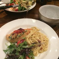 A picture of Spinach and ricotta stuffed chicken with pasta.