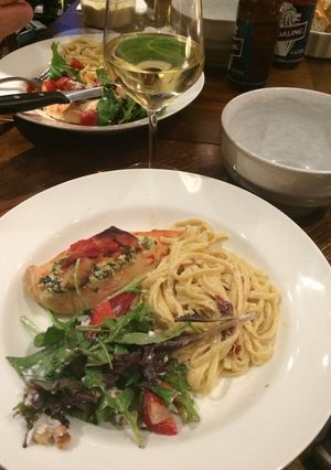 A picture of Spinach and ricotta stuffed chicken with pasta.