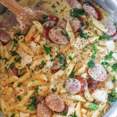 A picture of Cajun chicken and sausage Alfredo.