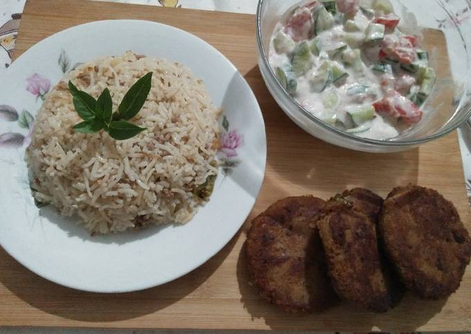 Qeemay rice with shami kabab and vegetables salad