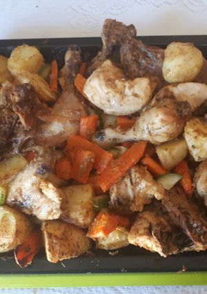 A picture of Grilled chicken with vegetables.