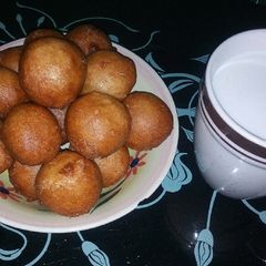 A picture of Puff puff and milk drink.
