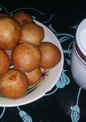 A picture of Puff puff and milk drink.