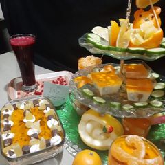 A picture of Pomegranate juice and orange trifle.