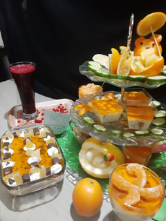 A picture of Pomegranate juice and orange trifle.