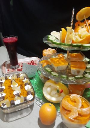 A picture of Pomegranate juice and orange trifle.