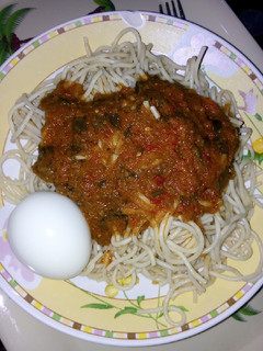 A picture of Spaghetti, egg and stew.