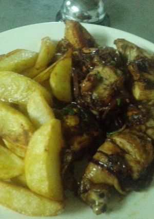 A picture of Roasted potatoes and fried pork.
