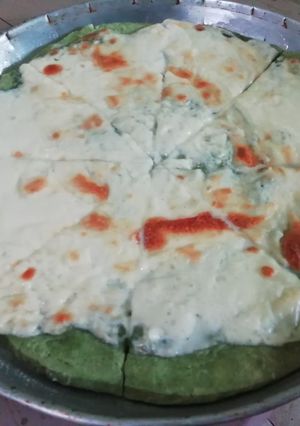 Una foto de Pizza de papa y espinaca
