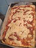 Pizza con doble salsas y orégano