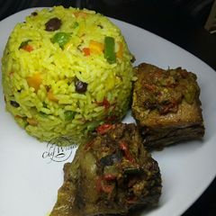 A picture of Fried rice and Baked Chicken.