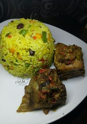 A picture of Fried rice and Baked Chicken.