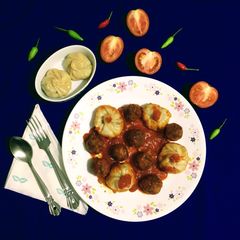 A picture of Fish Momo with Fish Balls in Red Sauce.