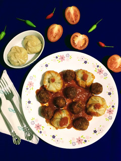 A picture of Fish Momo with Fish Balls in Red Sauce.