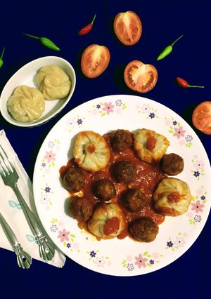 A picture of Fish Momo with Fish Balls in Red Sauce.