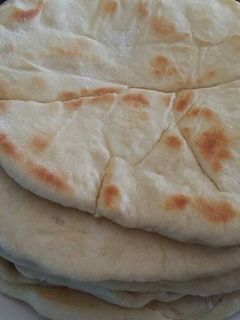 Una foto de Mi pan naan solo o relleno con ajo