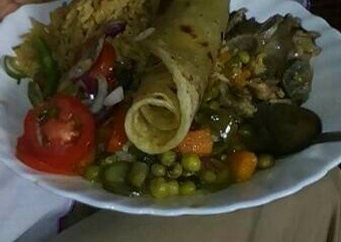 Rice and green peas and beef stew with kachumbari