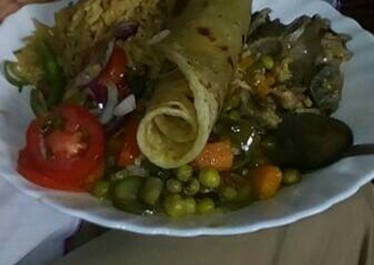 Rice and green peas and beef stew with kachumbari