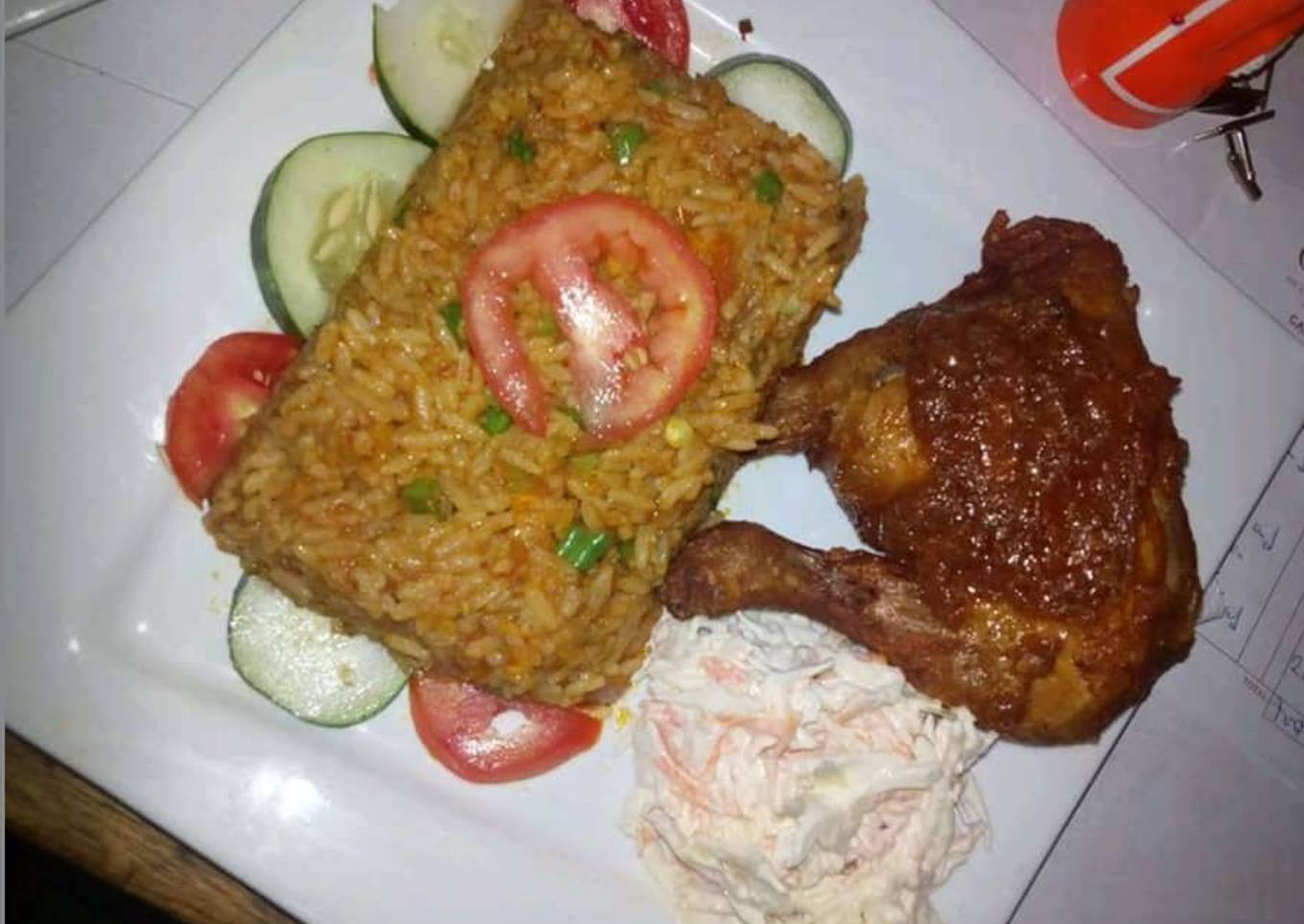 Jollof rice,coleslaw and grilled chicken