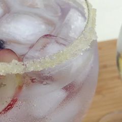 A picture of Gin and Tonic with Extra Virgin Olive Oil and sugar-rimmed glasses.