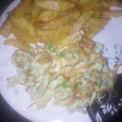A picture of Homemade French fries and vegetables scrambled egg.