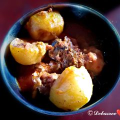 A picture of Murgir lal jhol(Traditional Bengali Dish).