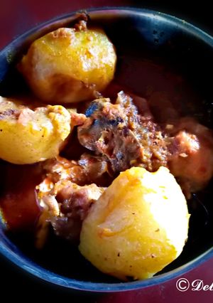 A picture of Murgir lal jhol(Traditional Bengali Dish).