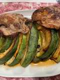 Côtes de porc aux demies lunes de courgette ronde marinées grillées