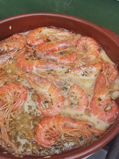 Una foto de Langostinos al ron