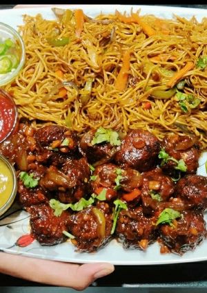 A picture of Veg Noddles with dry manchurian balls.