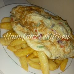 A picture of Chips and fried egg.