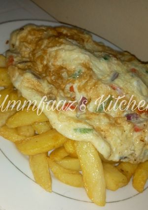 A picture of Chips and fried egg.