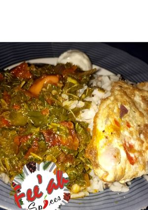 A picture of White rice wv vegetable sauce n fried n boiled egg.