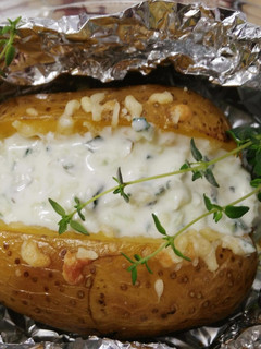 A picture of Baked Potatoes with Manchego Cheese and Tzatziki.