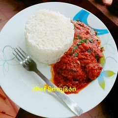 A picture of Rice and tomato stew.