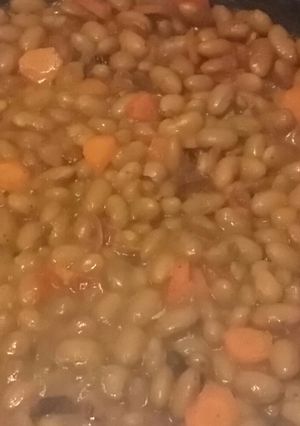 A picture of Rice served with yellow beans.