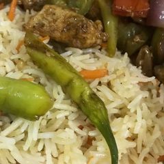 A picture of Chilli chicken with fried rice.