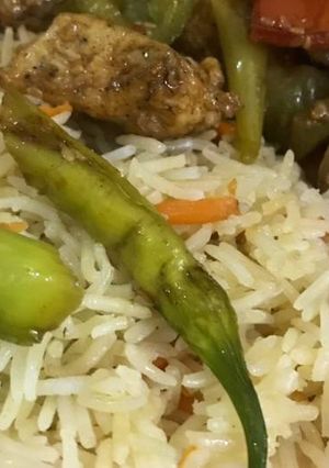 A picture of Chilli chicken with fried rice.