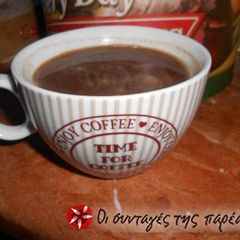 A picture of Light beverage with cocoa powder and Greek coffee.