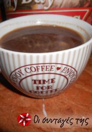 A picture of Light beverage with cocoa powder and Greek coffee.