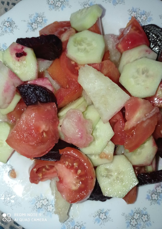 Una foto de Ensalada de tomate y melón