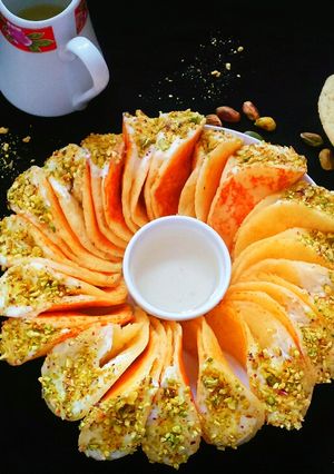 A picture of Katayef with cream cheese or shrikhand.