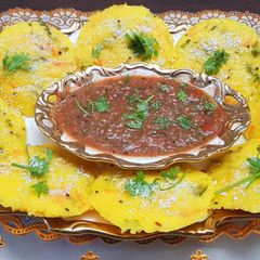 A picture of Mix veggie rava idli with tomato chutney.