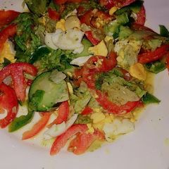 Vegetable salad served with boiled eggs A picture of Vegetable salad served with boiled eggs.